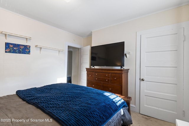 bedroom featuring light colored carpet and ornamental molding