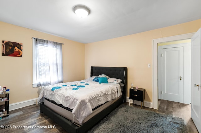 bedroom featuring dark hardwood / wood-style flooring