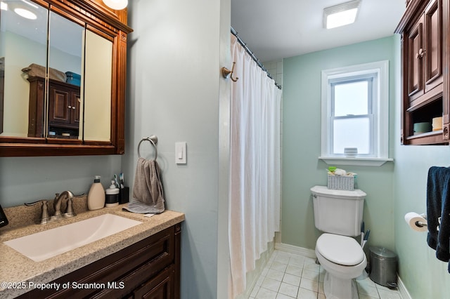 bathroom featuring a shower with shower curtain, vanity, toilet, and tile patterned flooring