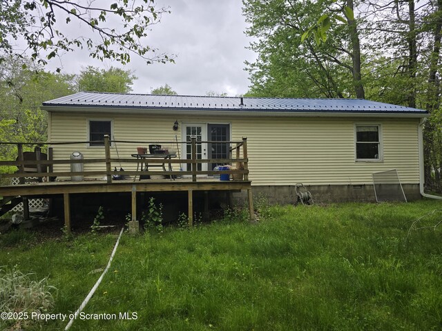 1563 Black Birch Way, Tobyhanna, PA 18466 - rear view of property featuring a wooden deck and metal roof