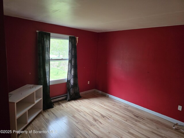 1563 Black Birch Way, Tobyhanna, PA 18466 - unfurnished room with a baseboard radiator, wood finished floors, and baseboards
