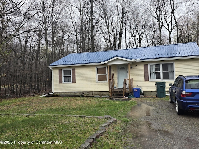 1563 Black Birch Way, Tobyhanna, PA 18466 - view of front of house with metal roof and a front yard