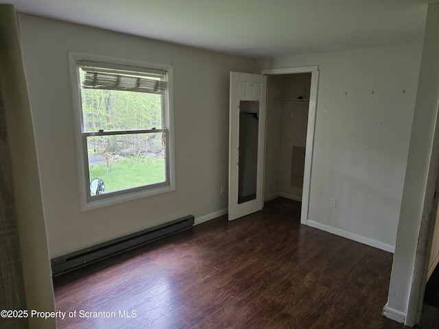 1563 Black Birch Way, Tobyhanna, PA 18466 - unfurnished bedroom with a baseboard radiator, dark wood-style floors, baseboards, and a closet