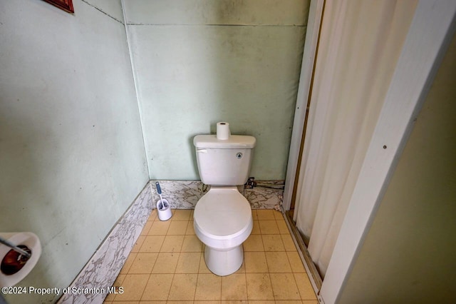 bathroom featuring toilet