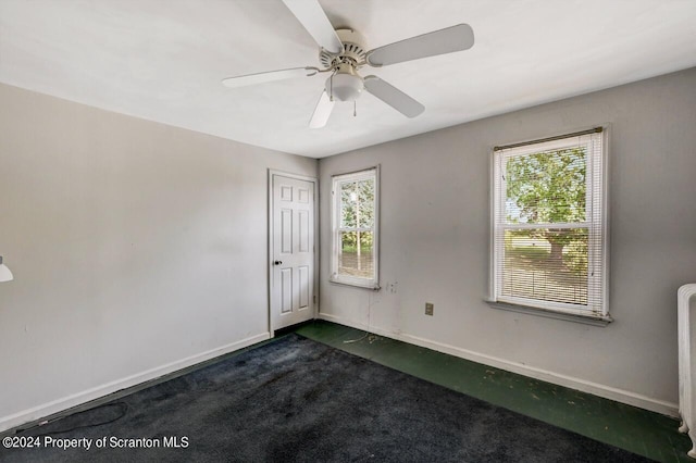 carpeted empty room with ceiling fan