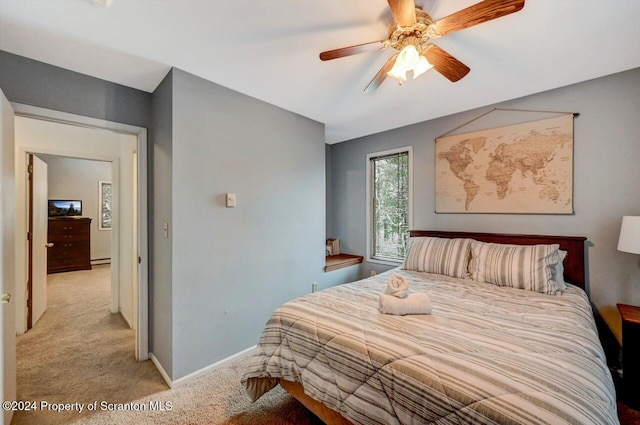 carpeted bedroom featuring ceiling fan