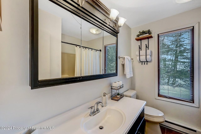 bathroom with walk in shower, vanity, toilet, and baseboard heating