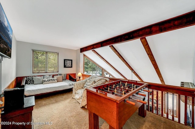 recreation room with lofted ceiling with beams and carpet floors