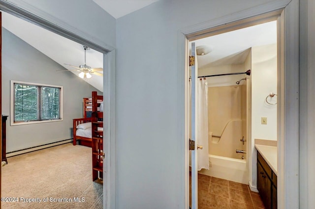 bathroom with ceiling fan, a baseboard radiator, vaulted ceiling, shower / tub combo with curtain, and vanity