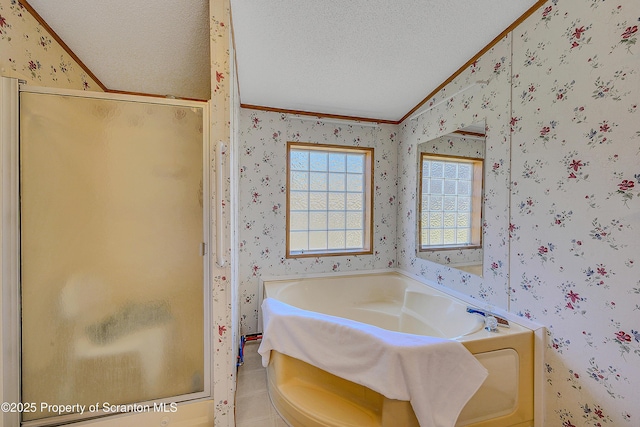 815 Svecz Rd, Union Dale, PA 18470 - bathroom featuring a textured ceiling, a garden tub, lofted ceiling, and wallpapered walls