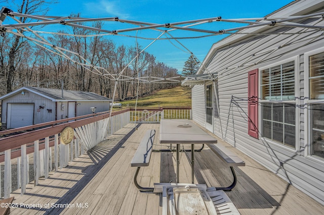 815 Svecz Rd, Union Dale, PA 18470 - wooden deck with an outbuilding, a garage, and outdoor dining space