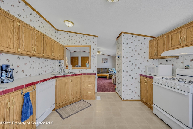 815 Svecz Rd, Union Dale, PA 18470 - kitchen with wallpapered walls, white appliances, under cabinet range hood, tile countertops, and a sink