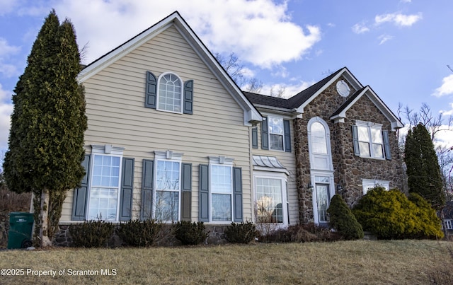 view of front property with a front lawn