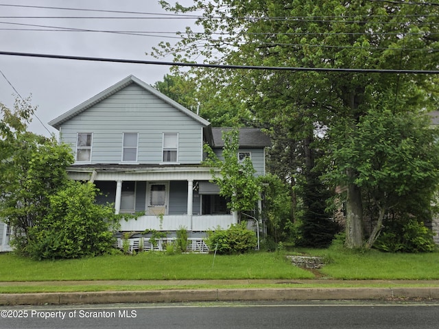 245 Main St, Archbald, PA 18403 - view of front facade with a front yard and a porch