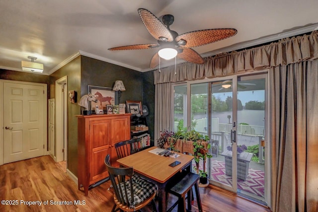 7 Lakeside Dr, Clarks Summit, PA 18411 - dining space with ceiling fan, wood finished floors, and ornamental molding