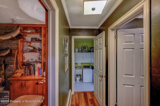 7 Lakeside Dr, Clarks Summit, PA 18411 - corridor with washer / dryer, wood finished floors, crown molding, and a sink