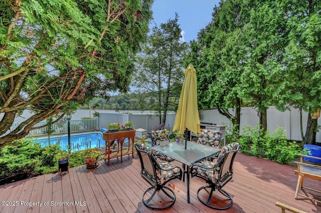 7 Lakeside Dr, Clarks Summit, PA 18411 - wooden terrace with outdoor dining space and a fenced backyard