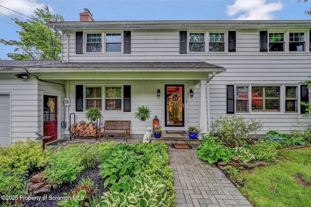 7 Lakeside Dr, Clarks Summit, PA 18411 - view of front of home with covered porch and a chimney