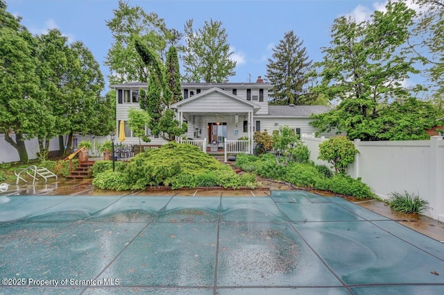 7 Lakeside Dr, Clarks Summit, PA 18411 - view of front of property with fence, covered porch, and a chimney