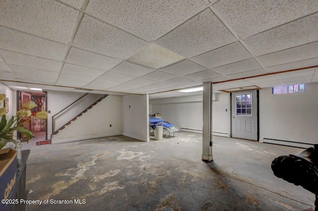 7 Lakeside Dr, Clarks Summit, PA 18411 - below grade area featuring a baseboard radiator, a drop ceiling, stairs, and baseboard heating
