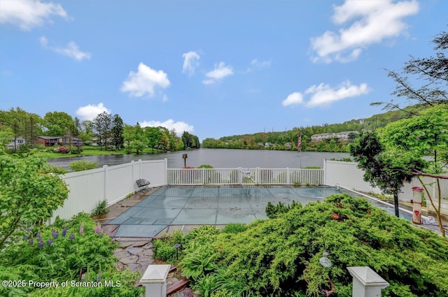7 Lakeside Dr, Clarks Summit, PA 18411 - view of pool featuring a patio, a fenced backyard, a water view, and view of scattered trees