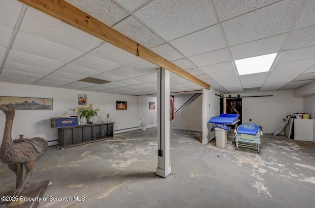 7 Lakeside Dr, Clarks Summit, PA 18411 - finished below grade area with a drop ceiling, a baseboard radiator, and stairs