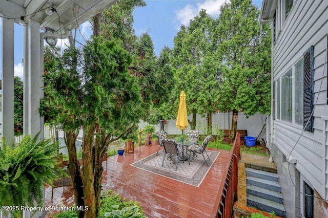 7 Lakeside Dr, Clarks Summit, PA 18411 - wooden deck with outdoor dining area and a fenced backyard