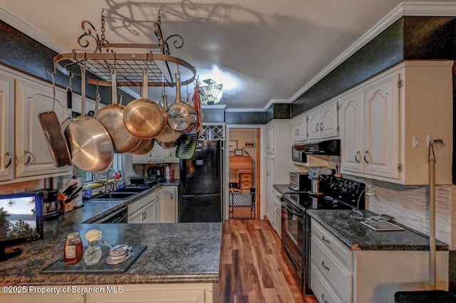 7 Lakeside Dr, Clarks Summit, PA 18411 - kitchen featuring black appliances, dark countertops, a sink, wood finished floors, and ornamental molding