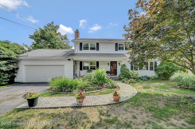 7 Lakeside Dr, Clarks Summit, PA 18411 - traditional home featuring driveway, a garage, a chimney, covered porch, and a front yard