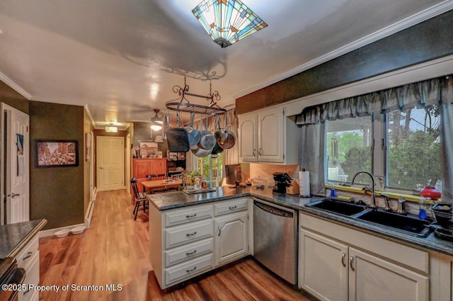 7 Lakeside Dr, Clarks Summit, PA 18411 - kitchen featuring stainless steel dishwasher, a peninsula, a sink, wood finished floors, and ornamental molding