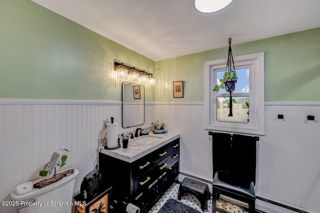 7 Lakeside Dr, Clarks Summit, PA 18411 - half bath featuring a wainscoted wall, toilet, vanity, and a baseboard heating unit