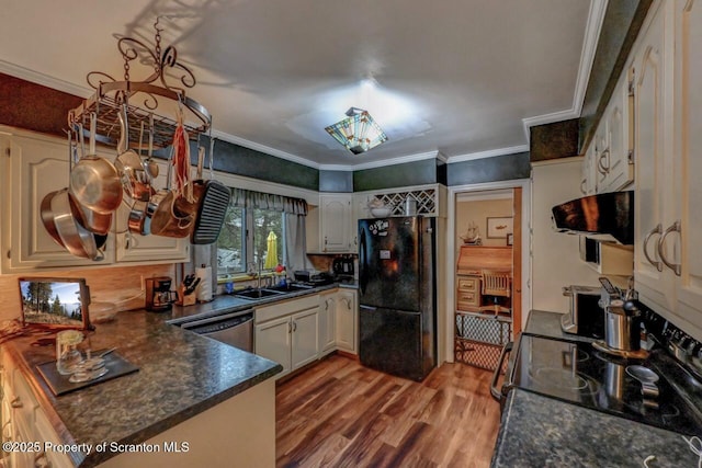 7 Lakeside Dr, Clarks Summit, PA 18411 - kitchen featuring black appliances, range hood, a sink, dark countertops, and wood finished floors