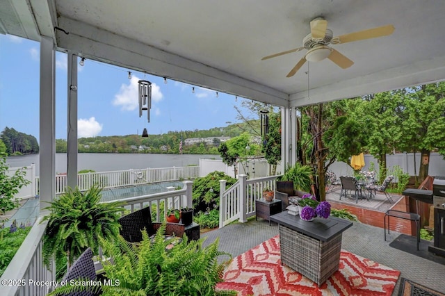 7 Lakeside Dr, Clarks Summit, PA 18411 - view of patio / terrace featuring ceiling fan, a water view, a fenced backyard, and outdoor dining area