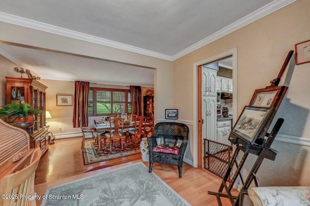 7 Lakeside Dr, Clarks Summit, PA 18411 - sitting room with wood finished floors, crown molding, and baseboard heating