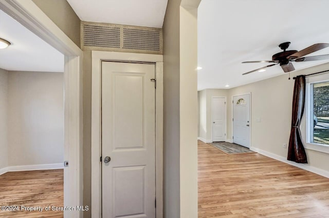 hall with light hardwood / wood-style floors