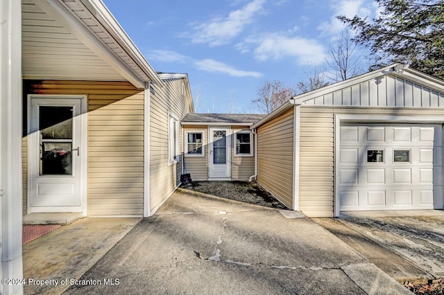 view of side of property featuring a garage