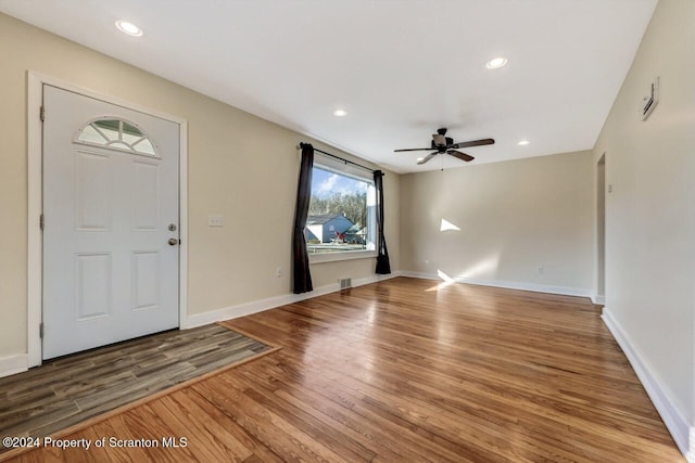 foyer entrance featuring hardwood / wood-style floors and ceiling fan