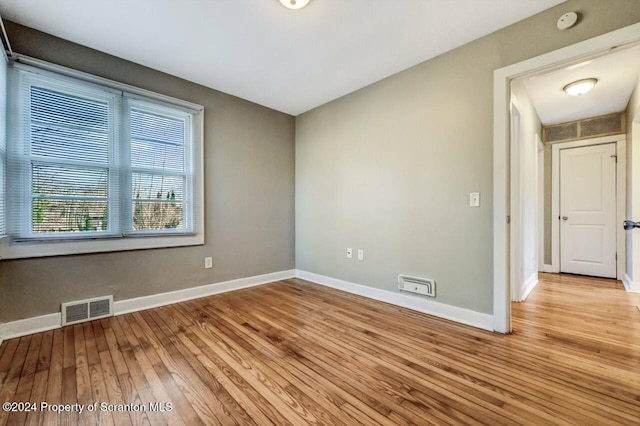 unfurnished room featuring light wood-type flooring