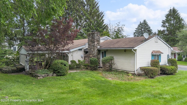 315 Delin Dr, South Abington Twp, PA 18411 - view of side of property with a yard, a chimney, and a shingled roof