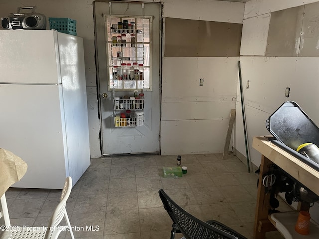 kitchen with freestanding refrigerator