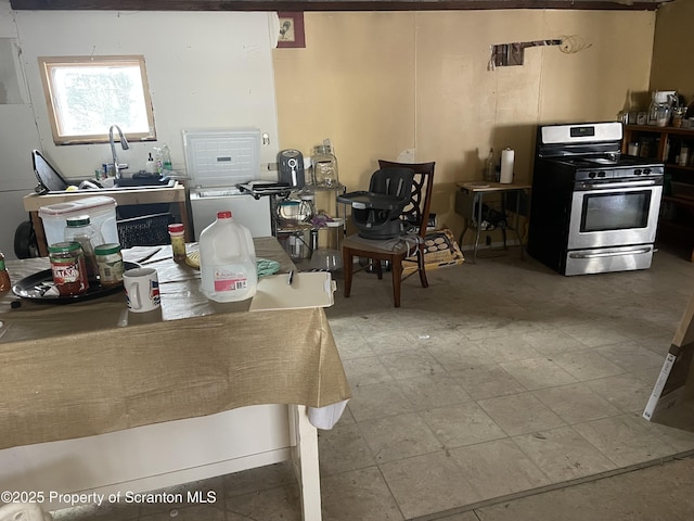 kitchen featuring stainless steel range with gas stovetop