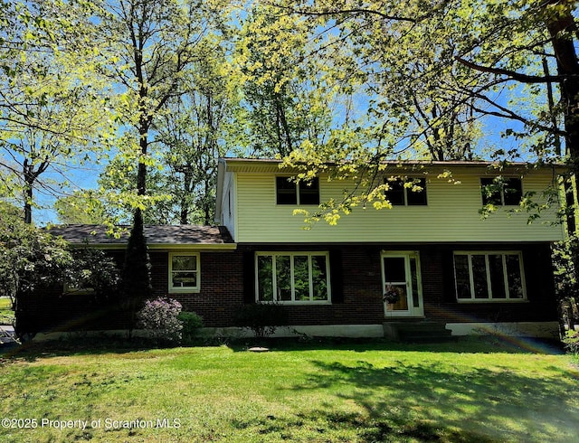 410 Lake Spangenberg Rd, Jefferson Twp, PA 18436 - view of front of property with a front yard and brick siding
