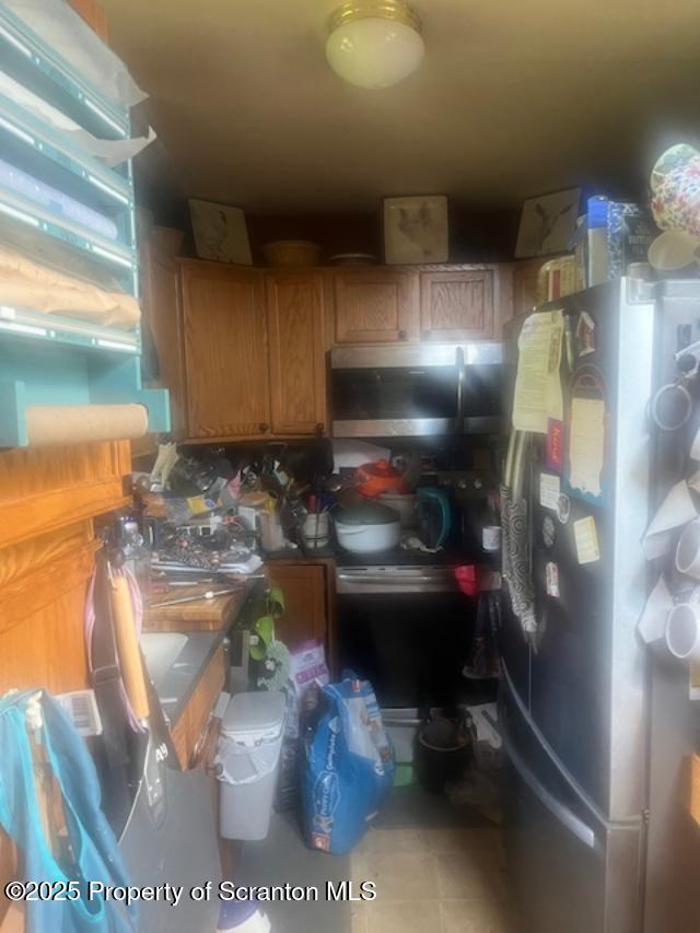 445 Bush Rd, Montrose, PA 18801 - kitchen with freestanding refrigerator and stainless steel microwave