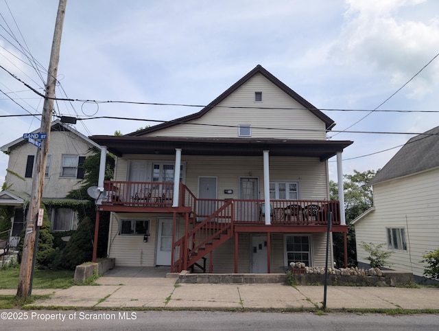 121 Sand St, Dunmore, PA 18510 - view of front of home with stairs, covered porch, and a patio area