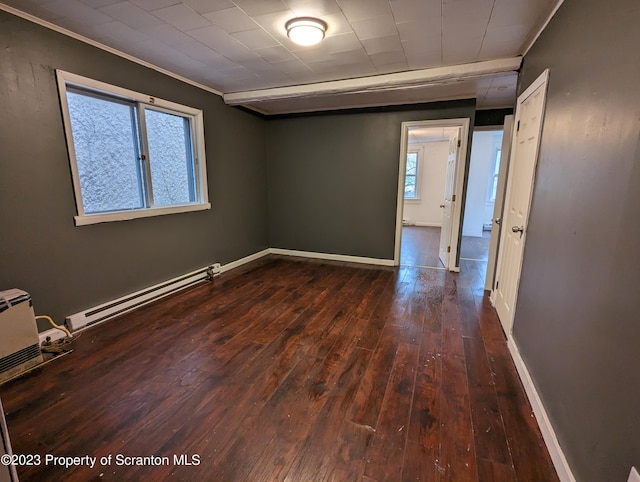 121 Sand St, Dunmore, PA 18510 - unfurnished room with baseboard heating, dark wood-type flooring, and ornamental molding