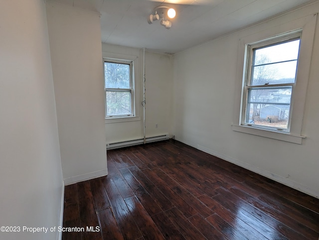 121 Sand St, Dunmore, PA 18510 - empty room featuring baseboard heating and dark wood-style flooring