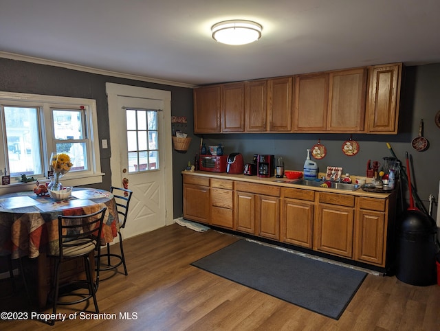 121 Sand St, Dunmore, PA 18510 - kitchen with brown cabinets, dark wood-style flooring, and light countertops