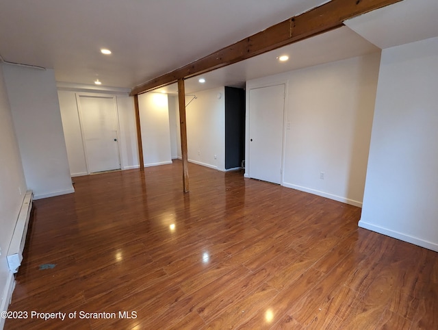 121 Sand St, Dunmore, PA 18510 - finished below grade area with recessed lighting, wood finished floors, and baseboard heating