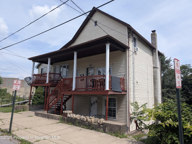 121 Sand St, Dunmore, PA 18510 - view of front of house featuring covered porch, a chimney, and stairs
