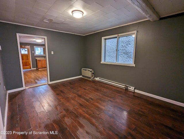 121 Sand St, Dunmore, PA 18510 - empty room featuring ornamental molding, a baseboard heating unit, and dark wood finished floors